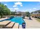 Wide view of the backyard featuring a large pool, a slide, and adjacent pool house at 120 Lu Tom Ln, Wendell, NC 27591