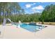 A full view of the large backyard pool, fire pit, water slide, and basketball hoop at 120 Lu Tom Ln, Wendell, NC 27591