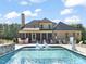 Beautiful backyard with a large pool, in-pool seating, and patio with seating for entertaining at 120 Lu Tom Ln, Wendell, NC 27591