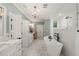 Luxurious bathroom with soaking tub, rain shower, and double vanity offers a serene and upscale experience at 120 Lu Tom Ln, Wendell, NC 27591
