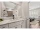 Bathroom with marble vanity top, white cabinets, and a view into the bedroom at 120 Lu Tom Ln, Wendell, NC 27591
