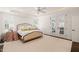 This bedroom is bright with shuttered doors leading outside and a ceiling fan at 120 Lu Tom Ln, Wendell, NC 27591