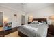 Cozy bedroom featuring a dark wood floor, ceiling fan, decor, and natural lighting at 120 Lu Tom Ln, Wendell, NC 27591