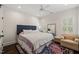 Cozy bedroom with hardwood floors, neutral walls, and comfortable seating area at 120 Lu Tom Ln, Wendell, NC 27591