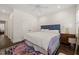 Bedroom with hardwood floors, neutral walls, a patterned rug, and a comfortable bed at 120 Lu Tom Ln, Wendell, NC 27591