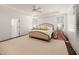 Spacious main bedroom has tray ceilings, plantation shutters, and access to an ensuite bathroom at 120 Lu Tom Ln, Wendell, NC 27591