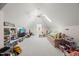 Large bonus room with vaulted ceilings, skylight, window seat, and plush carpeting at 120 Lu Tom Ln, Wendell, NC 27591