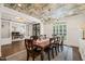 Dining room with hardwood floors, stylish ceiling wallpaper, and lots of natural light at 120 Lu Tom Ln, Wendell, NC 27591