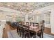 Open concept with dining room featuring unique floral ceiling and views into kitchen and living areas at 120 Lu Tom Ln, Wendell, NC 27591