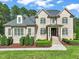 Charming two-story brick home with symmetrical design, gabled roof, and well-maintained lawn at 120 Lu Tom Ln, Wendell, NC 27591