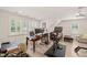 Bright home gym with modern exercise equipment, desk and workspace, and comfortable seating area at 120 Lu Tom Ln, Wendell, NC 27591