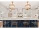 Kitchen boasts a large island, stainless steel appliances, and custom light fixtures at 120 Lu Tom Ln, Wendell, NC 27591