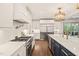 Gourmet kitchen featuring stainless steel appliances and a view into the outdoor living space at 120 Lu Tom Ln, Wendell, NC 27591