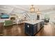 Open concept living with kitchen featuring a large island and inviting living room with fireplace at 120 Lu Tom Ln, Wendell, NC 27591