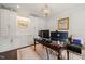 Well-appointed home office featuring custom built-ins, detailed millwork, and elegant decor at 120 Lu Tom Ln, Wendell, NC 27591