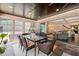 Bright sunroom with a dining area, brick accents, and an open flow to the main house at 120 Lu Tom Ln, Wendell, NC 27591