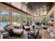 Inviting sunroom filled with wicker furniture, a dining area, and views of the pool at 120 Lu Tom Ln, Wendell, NC 27591