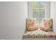 Window seat with decorative pillows providing a cozy spot to relax by the window at 120 Lu Tom Ln, Wendell, NC 27591