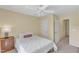 Cozy bedroom features neutral tones, carpet, ceiling fan, and ensuite bath at 1201 Red Beech Ct, Raleigh, NC 27614