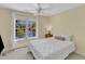 Sunlit bedroom with view of the serene backyard lake and fountain at 1201 Red Beech Ct, Raleigh, NC 27614