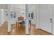 Dining room with hardwood floors, wainscoting, large windows and modern chandelier at 1201 Red Beech Ct, Raleigh, NC 27614