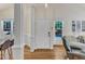 Entryway with hardwood floors, white trim, and natural light from the large windows at 1201 Red Beech Ct, Raleigh, NC 27614