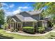 Spacious home with a well-kept lawn, mature landscaping, and an attached two-car garage at 1201 Red Beech Ct, Raleigh, NC 27614