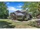 Lovely home with lush landscaping, mature trees, and an attached two-car garage at 1201 Red Beech Ct, Raleigh, NC 27614