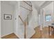 Grand foyer with high ceilings, detailed wainscoting, hardwood floors and staircase at 1201 Red Beech Ct, Raleigh, NC 27614