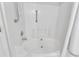 White tile surround on soaking tub with updated shower fixtures and hardware at 1201 Red Beech Ct, Raleigh, NC 27614