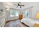 Bedroom with hardwood floors, natural light, and a ceiling fan at 1209 Eva St, Durham, NC 27703