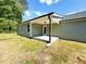 Back porch featuring ample space and natural light is perfect for outdoor relaxation at 121 Earnest Way, Kenly, NC 27542