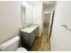 Bathroom features a granite countertop, modern vanity, and wood-look flooring, creating a stylish and functional space at 121 Earnest Way, Kenly, NC 27542
