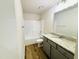 Well-lit bathroom featuring a granite countertop, modern vanity, and a shower-tub combination at 121 Earnest Way, Kenly, NC 27542