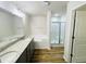 Bathroom featuring double sinks, granite counters, soaking tub and glass enclosed shower at 121 Earnest Way, Kenly, NC 27542