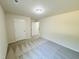 Spacious carpeted bedroom with closet and doorway, providing ample room for comfort and style at 121 Earnest Way, Kenly, NC 27542