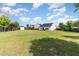 Sprawling backyard featuring well-kept lawn, shed, and fenced border at 123 Jonalker Ct, Clayton, NC 27520