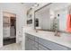 Bathroom featuring double vanity, large mirror, and separate walk in shower and closet at 123 Jonalker Ct, Clayton, NC 27520