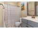 Cozy bathroom featuring neutral wallpaper and seashell shower curtain at 123 Jonalker Ct, Clayton, NC 27520