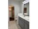 This bathroom has double sinks with a large mirror, and direct access to a large closet at 123 Jonalker Ct, Clayton, NC 27520