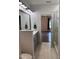 This modern bathroom features gray vanities, a large mirror, and a glass shower enclosure at 123 Jonalker Ct, Clayton, NC 27520
