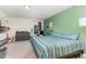 Charming bedroom with carpet floors and colorful accent wall at 123 Jonalker Ct, Clayton, NC 27520
