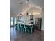 Bright kitchen with white cabinetry, a navy island, and stainless steel appliances offers a functional and stylish design at 123 Jonalker Ct, Clayton, NC 27520