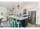 Bright kitchen boasts a large island with seating and stainless steel appliances at 123 Jonalker Ct, Clayton, NC 27520