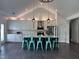 Spacious kitchen with white cabinets, a navy island, and pendant lighting offers a modern, inviting atmosphere at 123 Jonalker Ct, Clayton, NC 27520