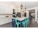 Modern kitchen with white cabinets, a large island with seating, and stainless steel appliances at 123 Jonalker Ct, Clayton, NC 27520