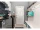 Well-lit laundry room with sleek machines and modern organization at 123 Jonalker Ct, Clayton, NC 27520