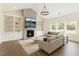 Bright living room featuring built-in shelves, a fireplace, and ample natural light at 123 Jonalker Ct, Clayton, NC 27520