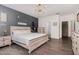 Modern bedroom with wood accent wall, plush carpet, and plenty of natural light at 123 Jonalker Ct, Clayton, NC 27520