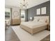 Modern bedroom with wood accent wall, plush carpet, and lots of natural light at 123 Jonalker Ct, Clayton, NC 27520